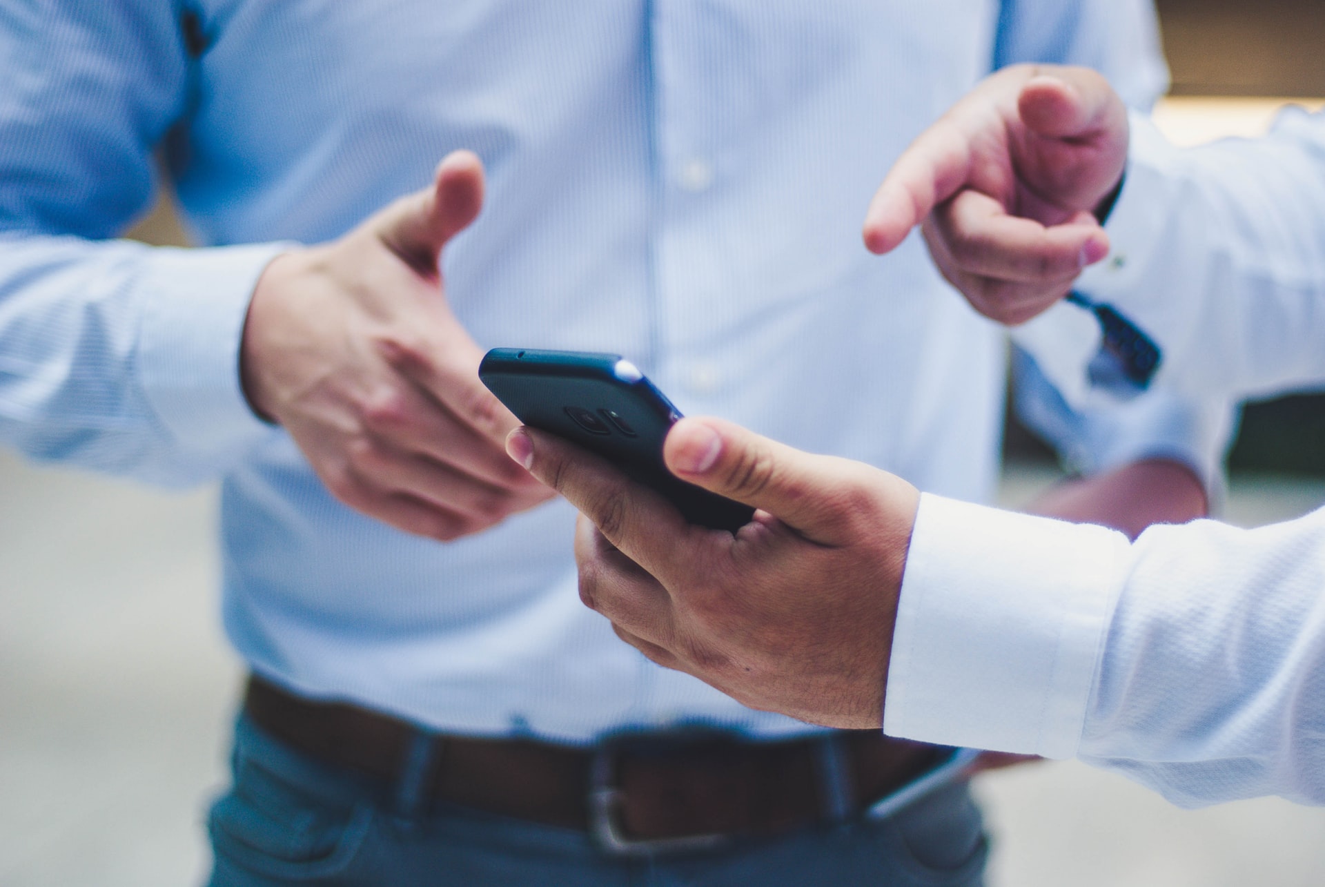 Person showing smart phone to contact